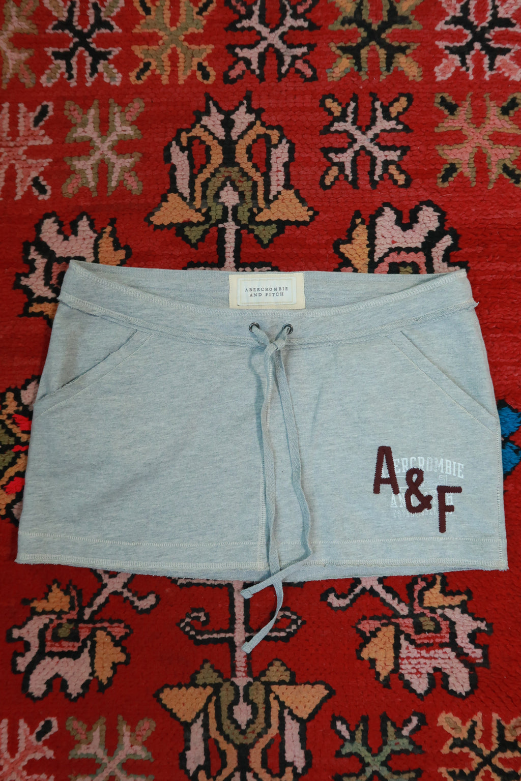 Vintage Abercrombie & Fitch mini skirt by Elektra Vintage, featuring classic Y2K style, shown laid flat with visible details.