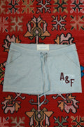 Vintage Abercrombie & Fitch mini skirt by Elektra Vintage, featuring classic Y2K style, shown laid flat with visible details.