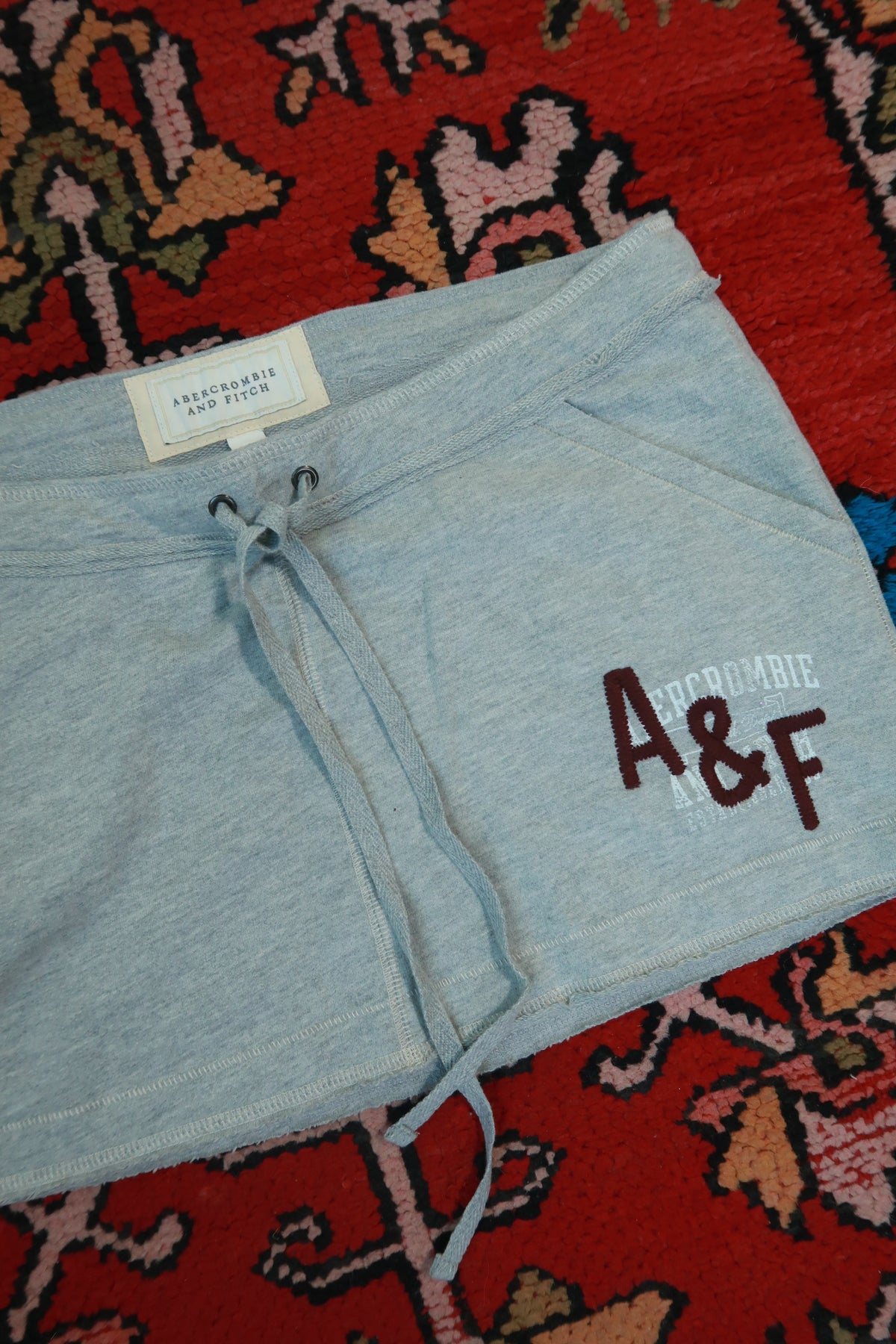 Vintage Abercrombie & Fitch Y2K mini skirt by Elektra Vintage, featuring a classic denim design and button closure.