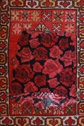 Vintage 2000s red rose print asymmetrical skirt by Elektra Vintage, showcasing its unique design and vibrant floral pattern.