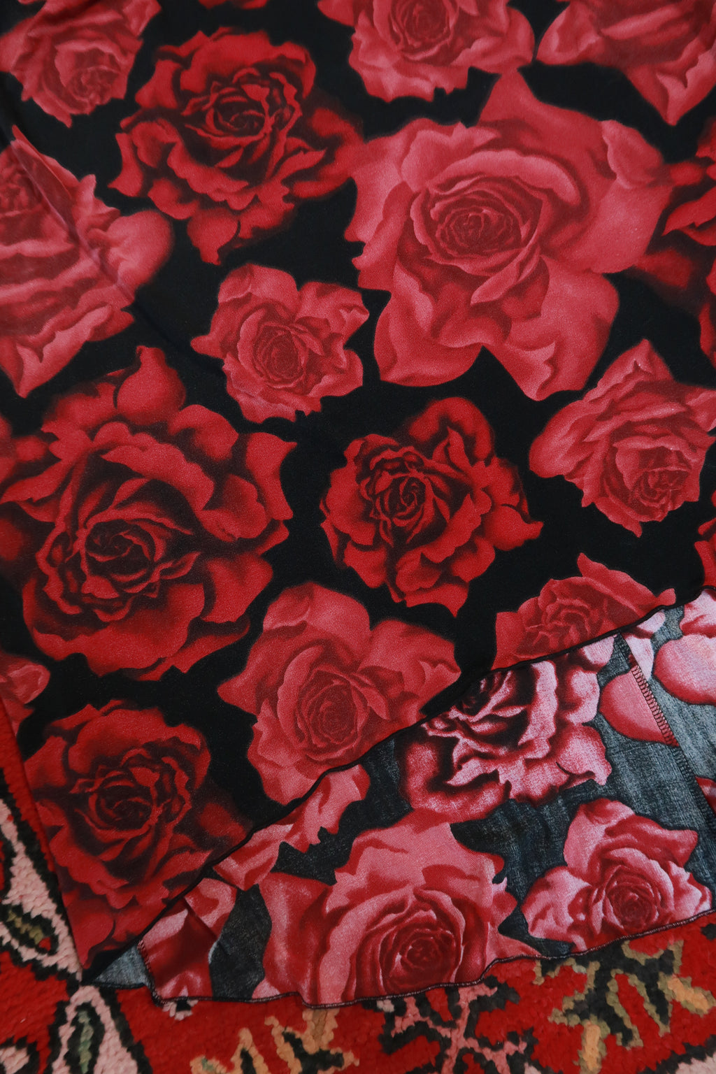 Red rose print asymmetrical skirt by Elektra Vintage, vintage 2000s style, featuring a flowing design and floral pattern.