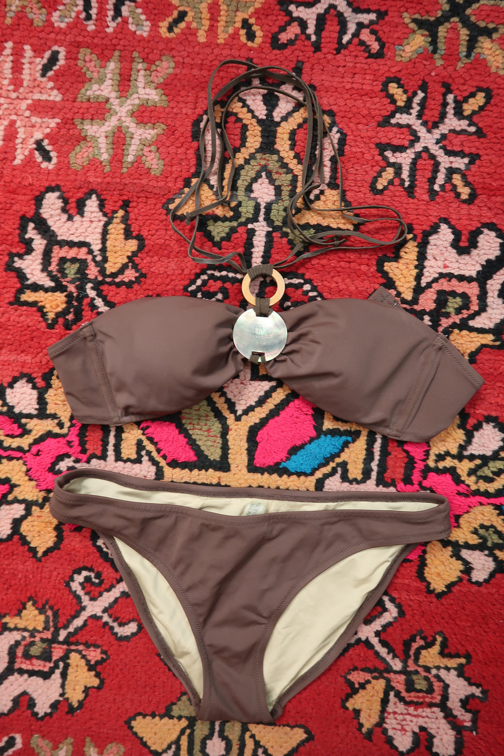 Vintage 2000s Victoria’s Secret brown bandeau bikini with Y2K style abalone shell detail, shown on a model.