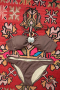 Vintage 2000s Victoria’s Secret brown bandeau bikini with Y2K style abalone shell detail, shown on a model.