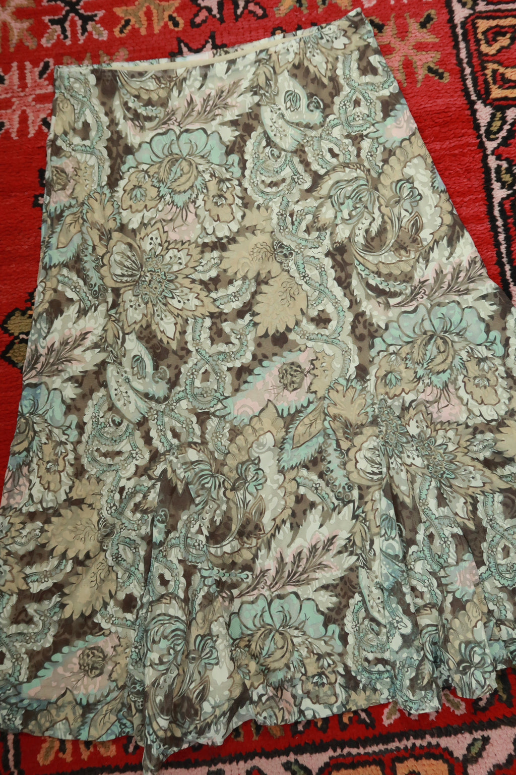 Elektra Vintage floral paisley midi A-line skirt with vintage-inspired pattern and flowing fabric, styled for casual or dressy wear.