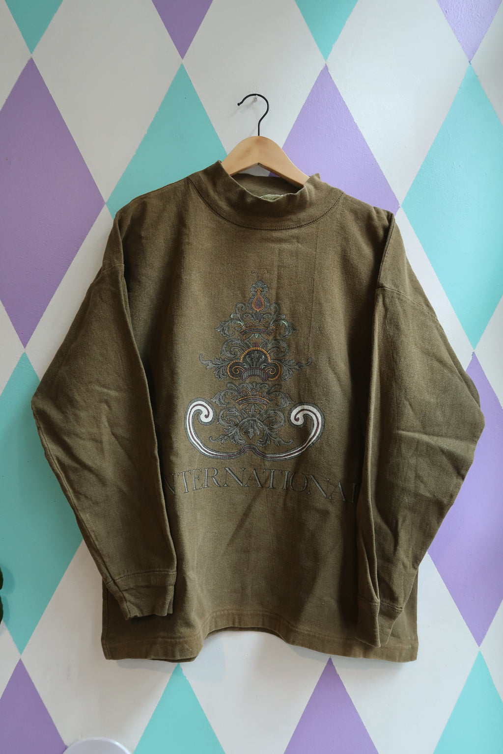 Vintage Olive Green “International” Graphic Sweatshirt – 90s Streetwear Pullover - Elektra Vintage
