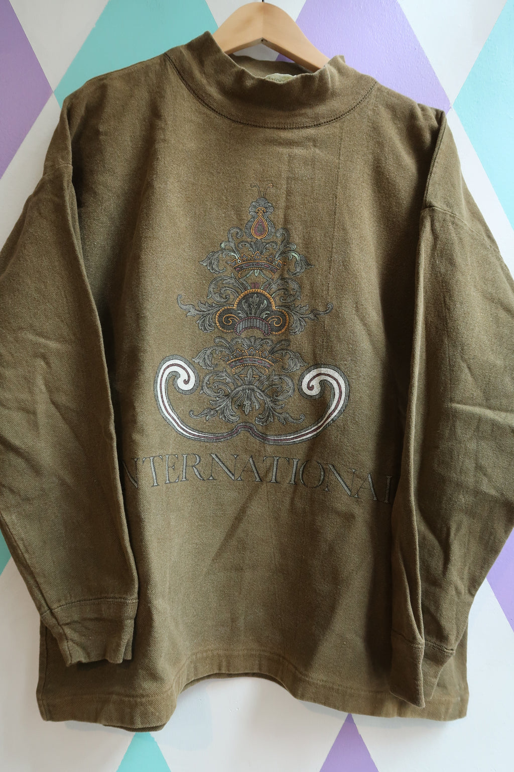 Vintage Olive Green “International” Graphic Sweatshirt – 90s Streetwear Pullover - Elektra Vintage
