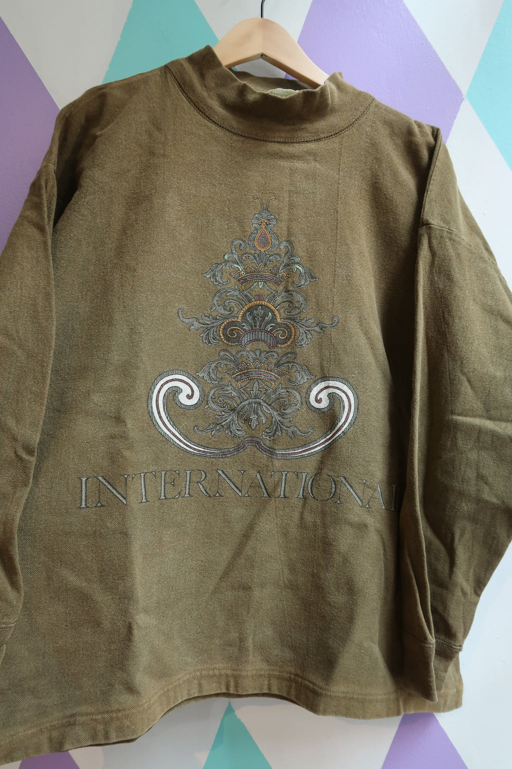 Vintage Olive Green “International” Graphic Sweatshirt – 90s Streetwear Pullover - Elektra Vintage