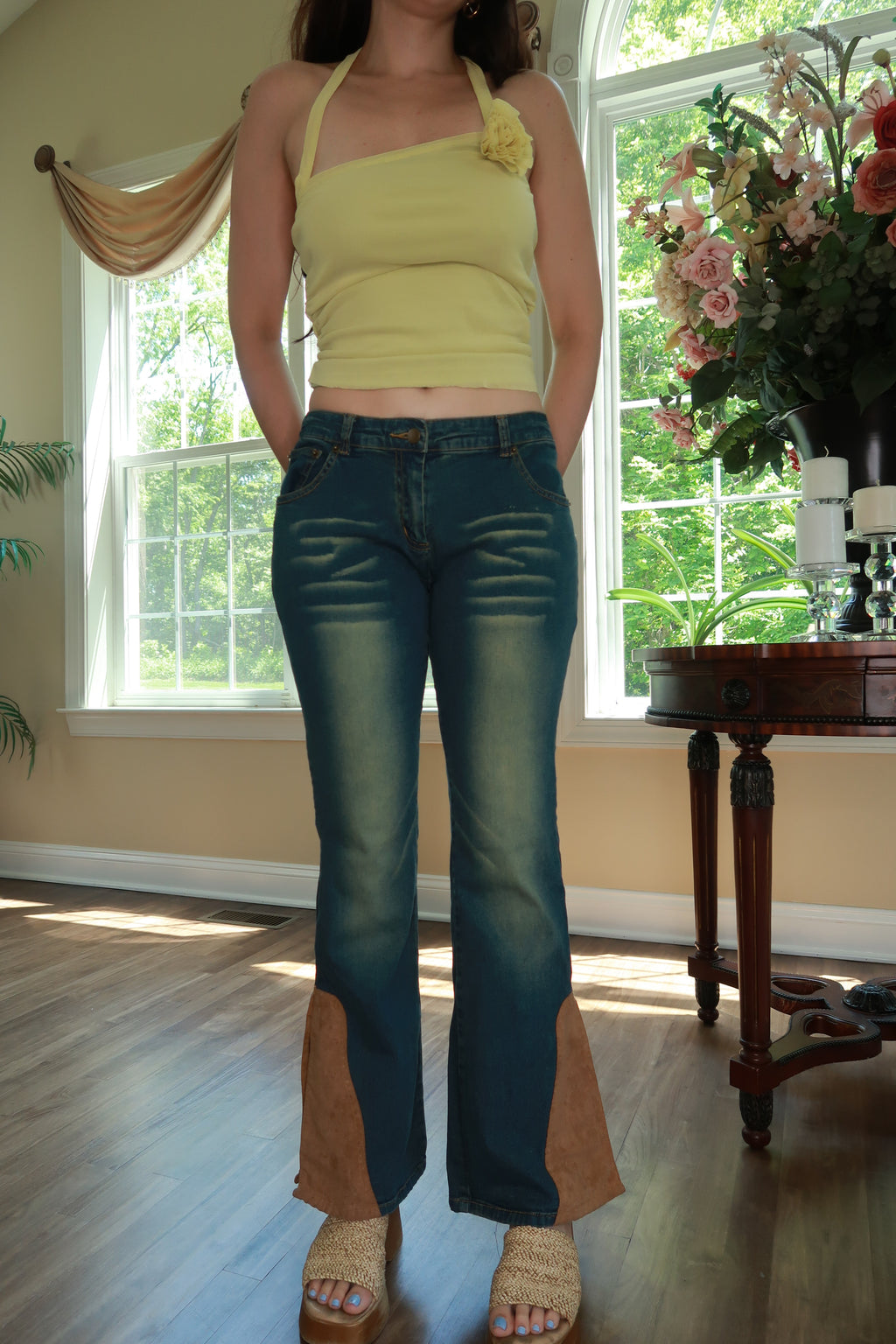 Women’s vintage Y2K denim flare jeans with suede panel details, from Elektra Vintage, showcasing high-waisted style and retro fashion.