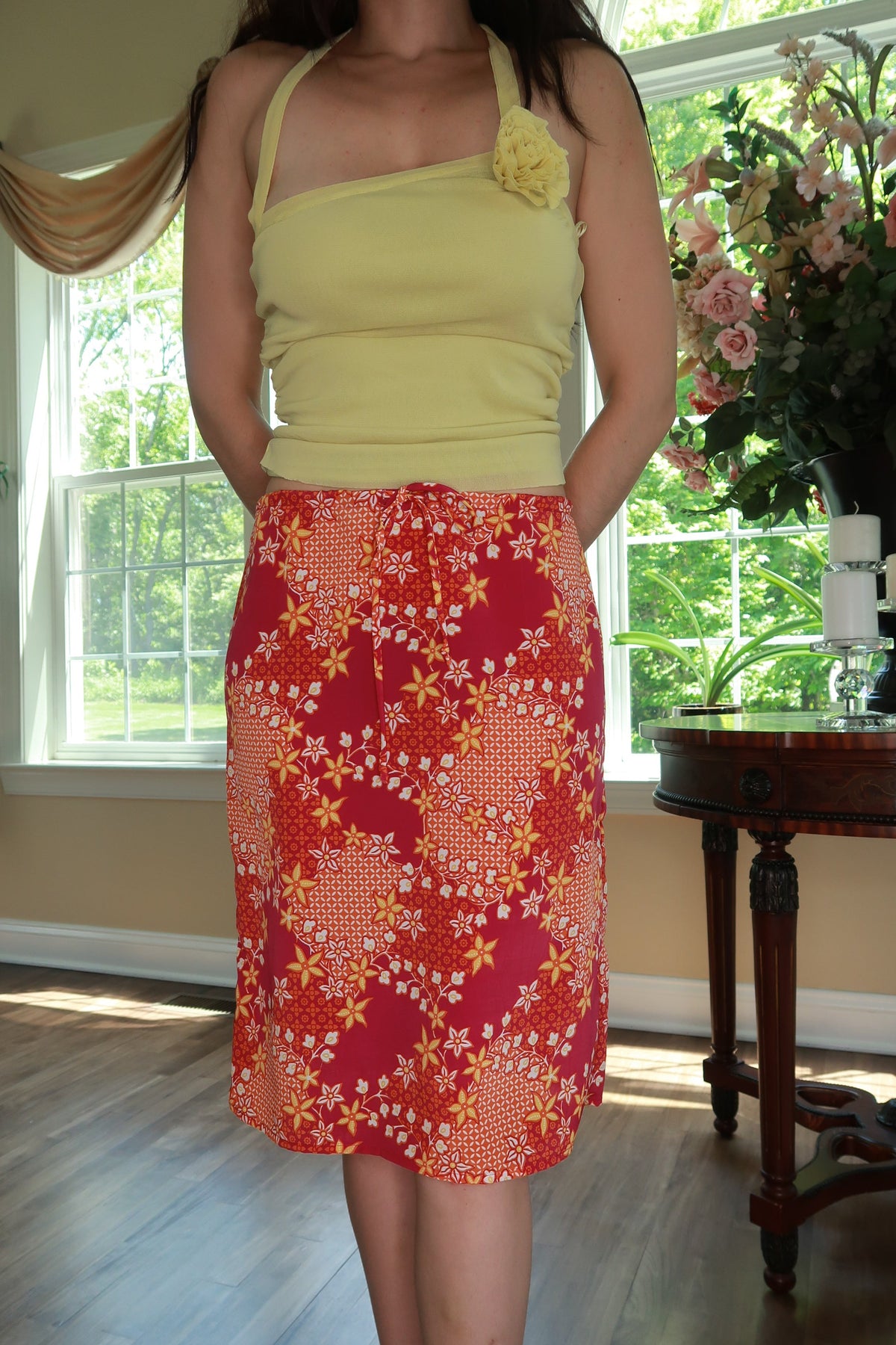 Pink and orange floral midi skirt by Elektra Vintage, vintage Y2K style with flowing fabric and floral pattern.