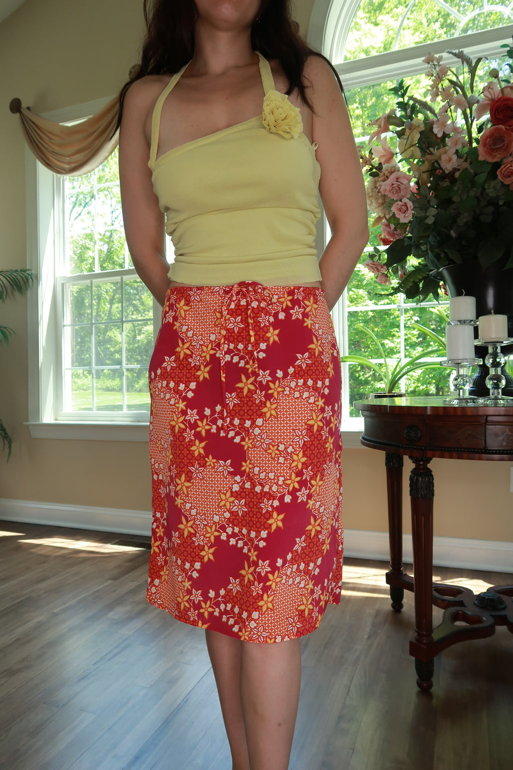 Pink and orange floral midi skirt from Elektra Vintage, vintage Y2K style with a flowing fabric and floral pattern.