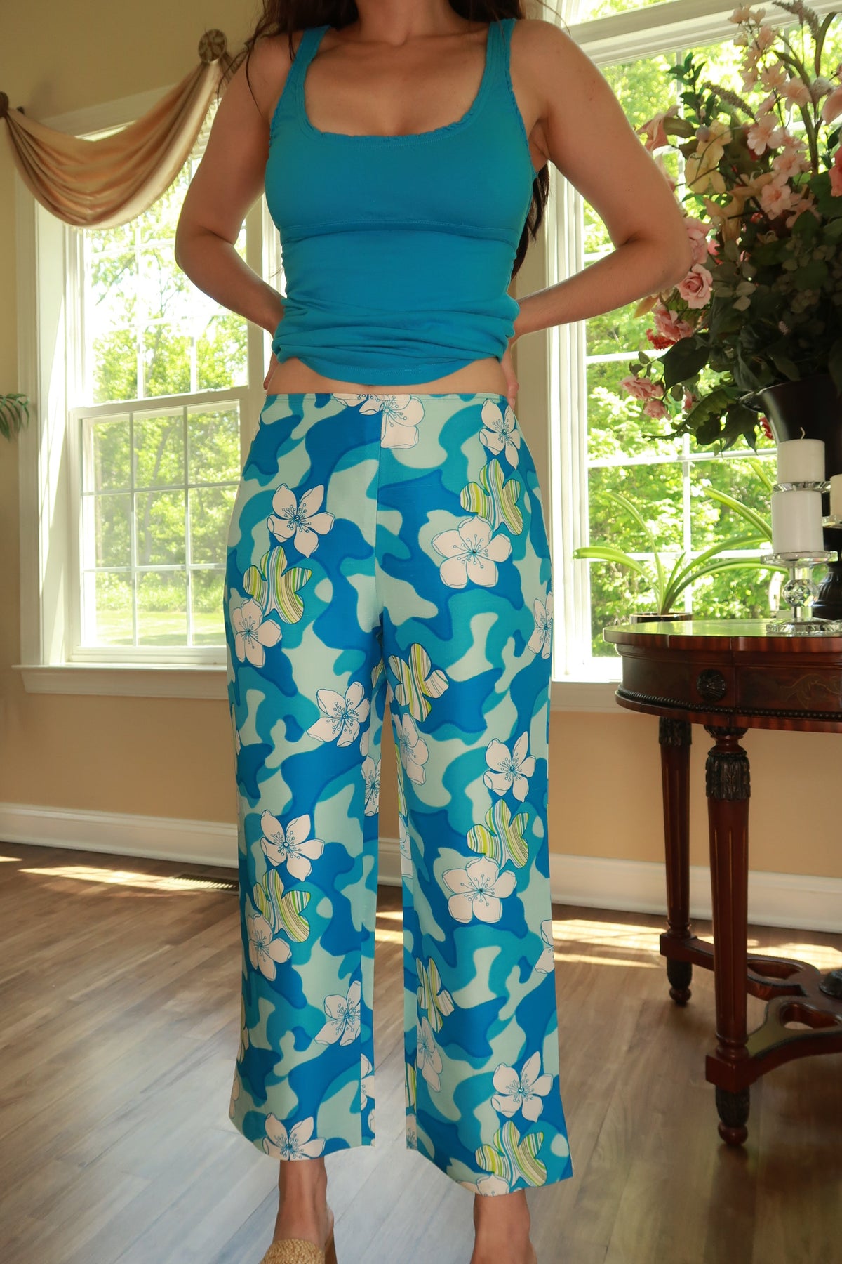 Elektra Vintage women's wide leg pants with vintage silk fabric, turquoise blue floral abstract print, and flowing style.