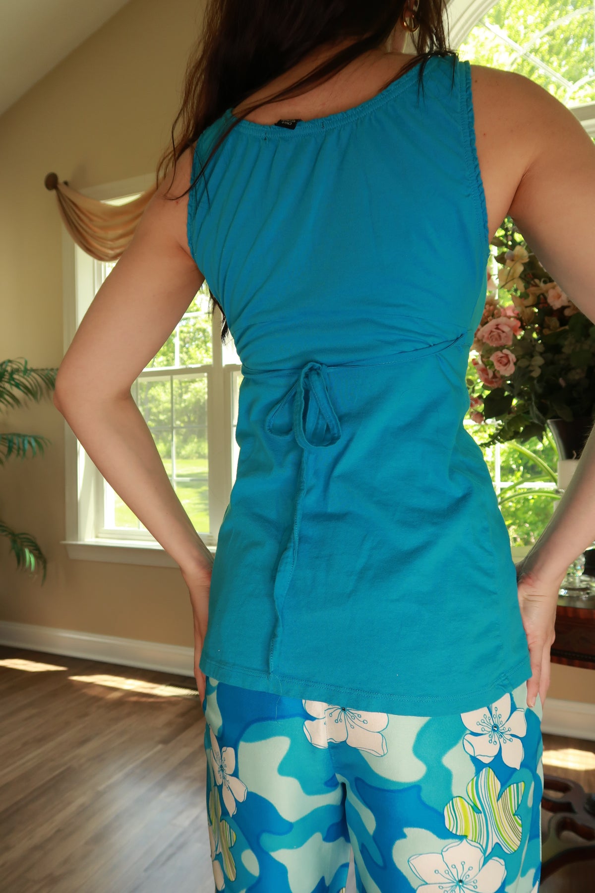 Vintage 2000s turquoise tie-back tank top for women by Elektra Vintage, featuring a sleeveless design and back tie detail.