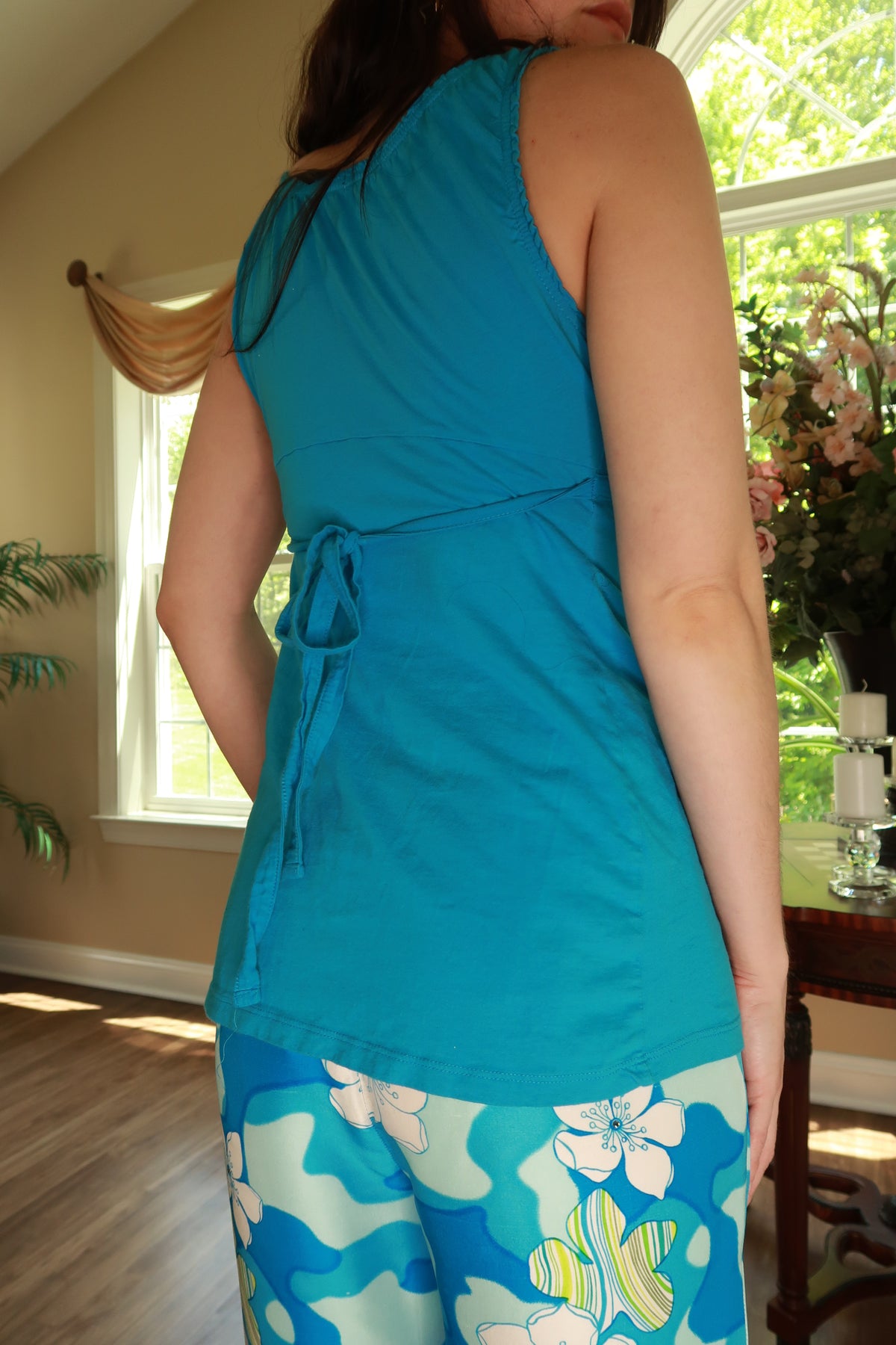 Vintage 2000s turquoise tie-back tank top for women by Elektra Vintage, featuring a stylish sleeveless design and back tie detail.