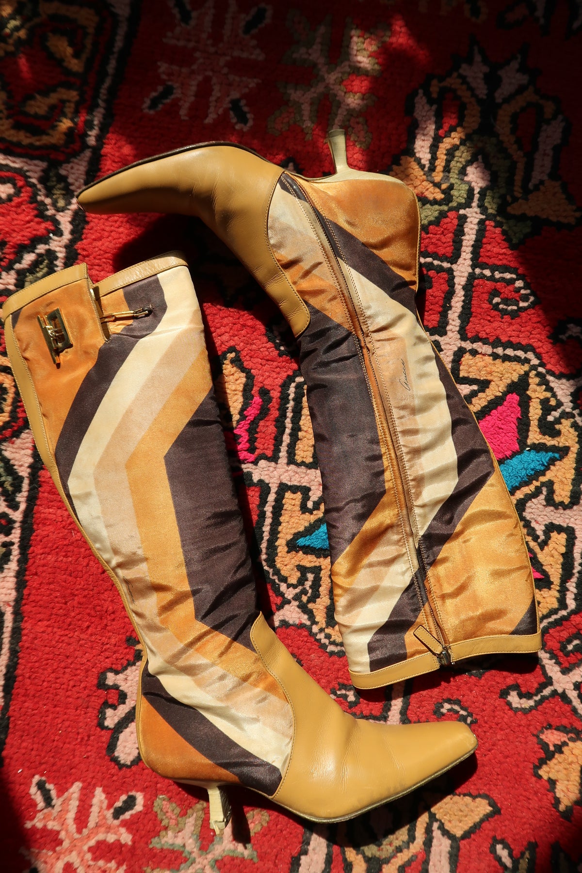 Vintage Gucci by Tom Ford Fall/Winter 2000 leather boots with iconic printed silk and stylish heels.