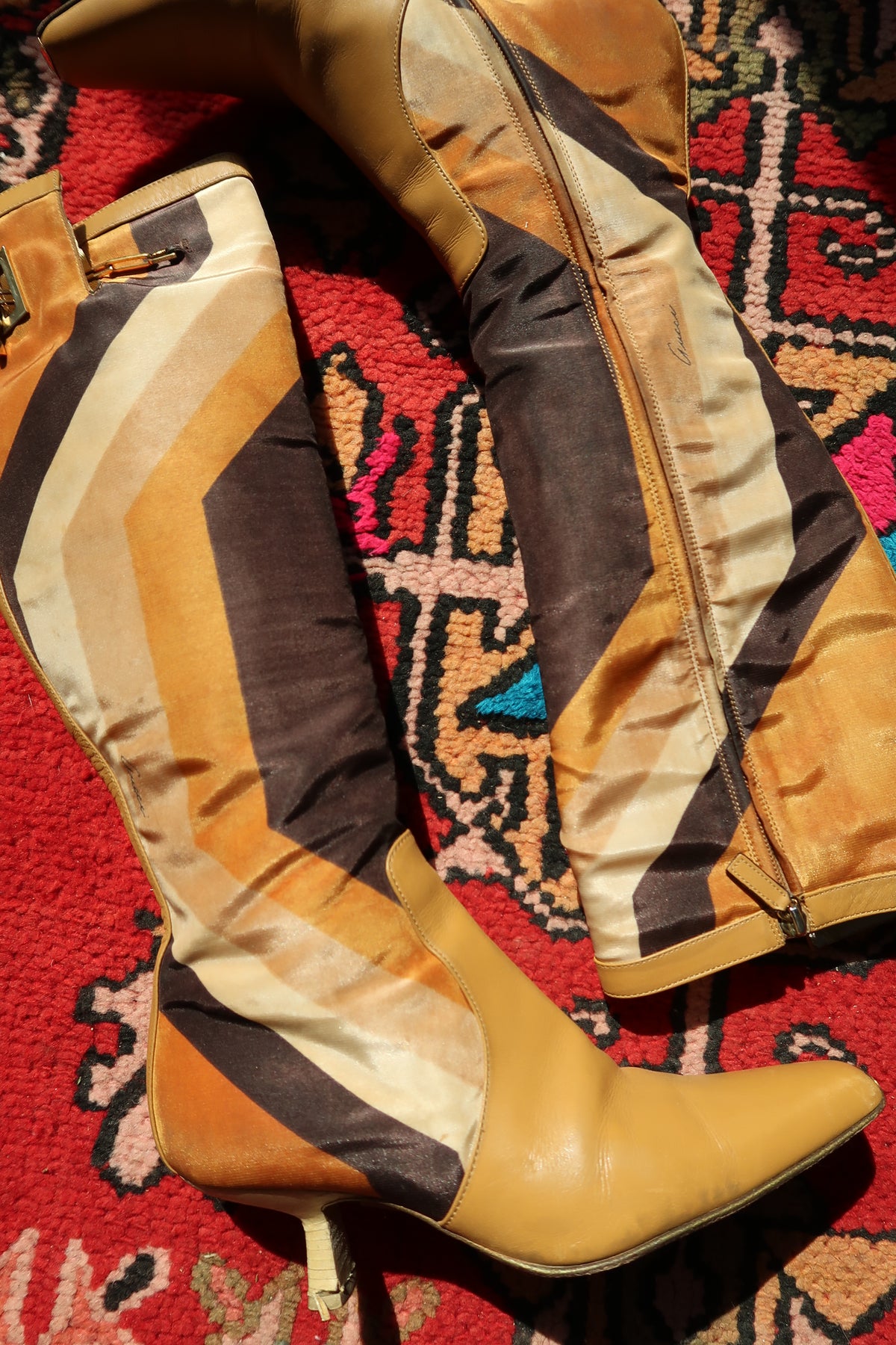 Vintage Gucci by Tom Ford Fall/Winter 2000 leather boots with iconic printed silk and stylish heels.