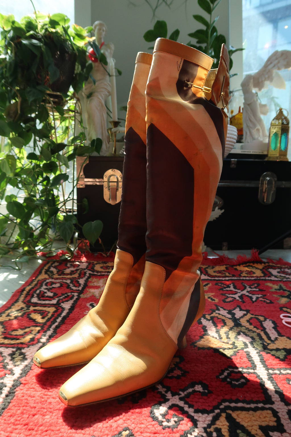 Gucci by Tom Ford vintage leather boots featuring iconic printed silk and elegant heels, showcased against a neutral background.