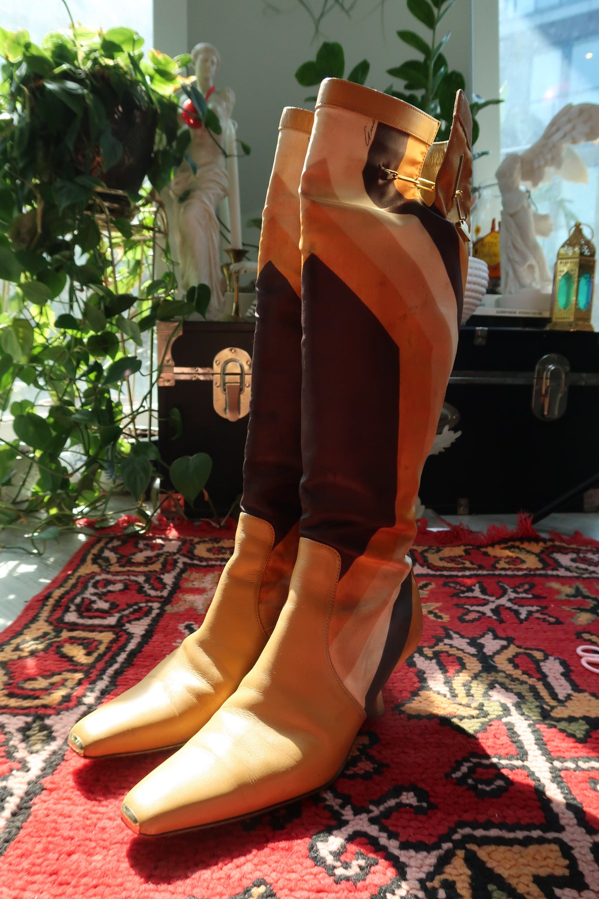 Gucci by Tom Ford vintage leather boots featuring iconic printed silk and elegant heels, showcased against a neutral background.