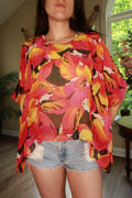 Elektra Vintage women's 2000s silk floral chiffon poncho blouse, lightweight, flowy top with vibrant floral pattern.