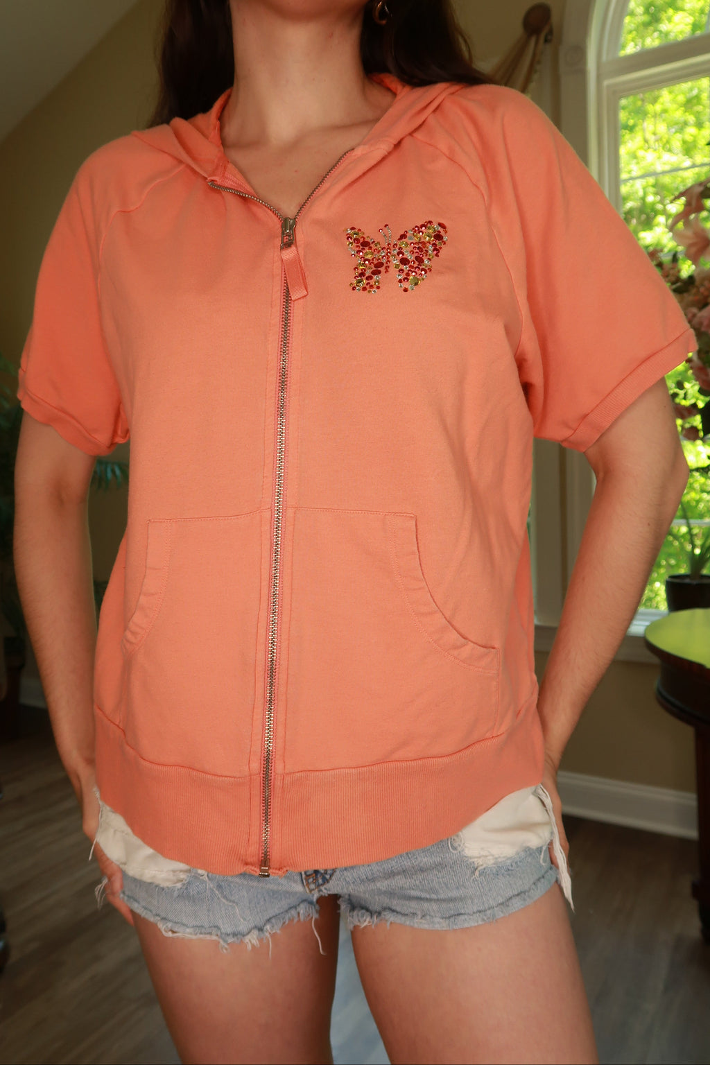 Vintage 2000s Peach Rhinestone Butterfly Zip-Up Hoodie for women by Elektra Vintage, showing front view with rhinestone details.