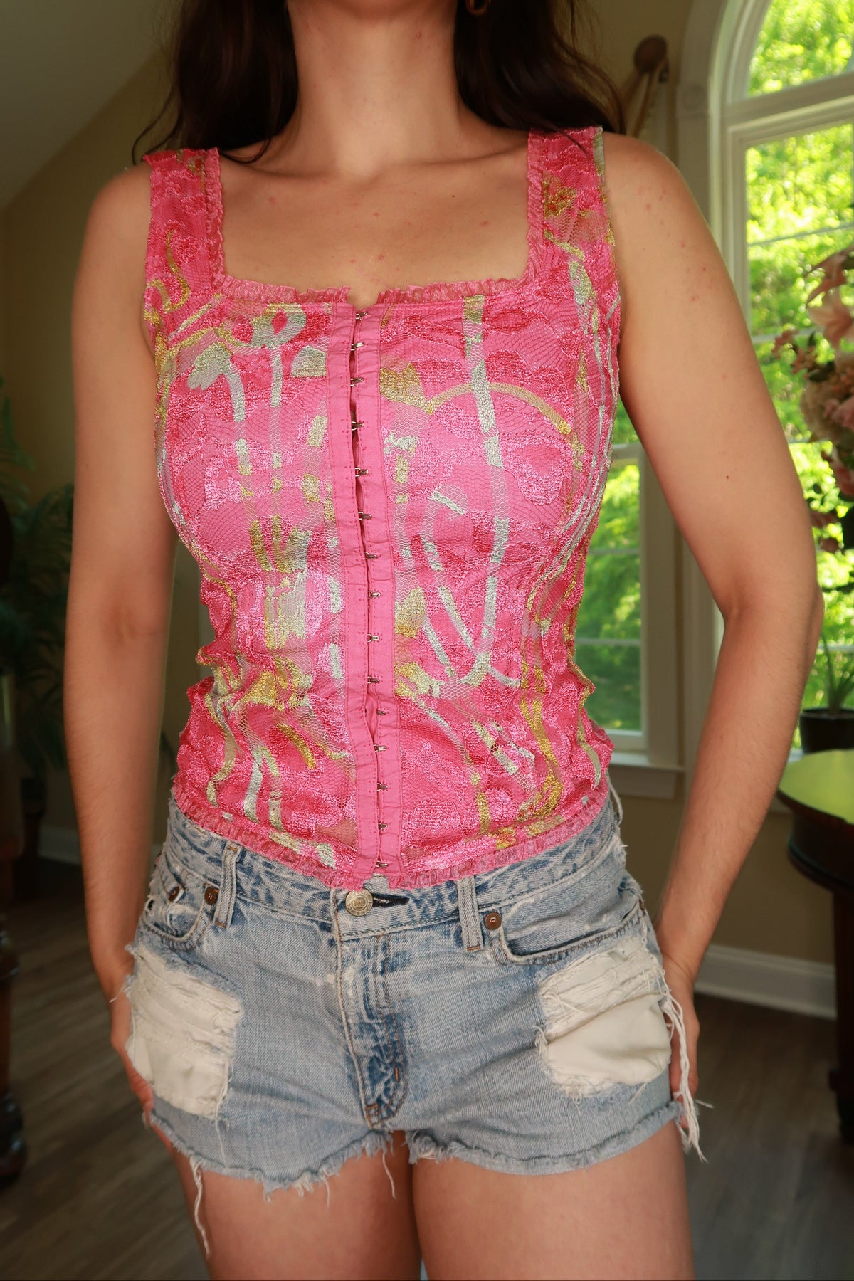 Vintage pink lace corset top by Elektra Vintage with hook front closure, featuring delicate lace details for a stylish women's top.
