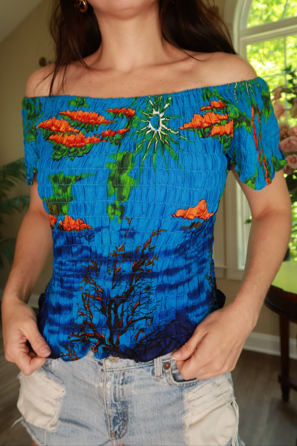 Vintage 2000s blue smocked off-shoulder tropical top for women by Elektra Vintage, featuring a relaxed fit and vibrant print.