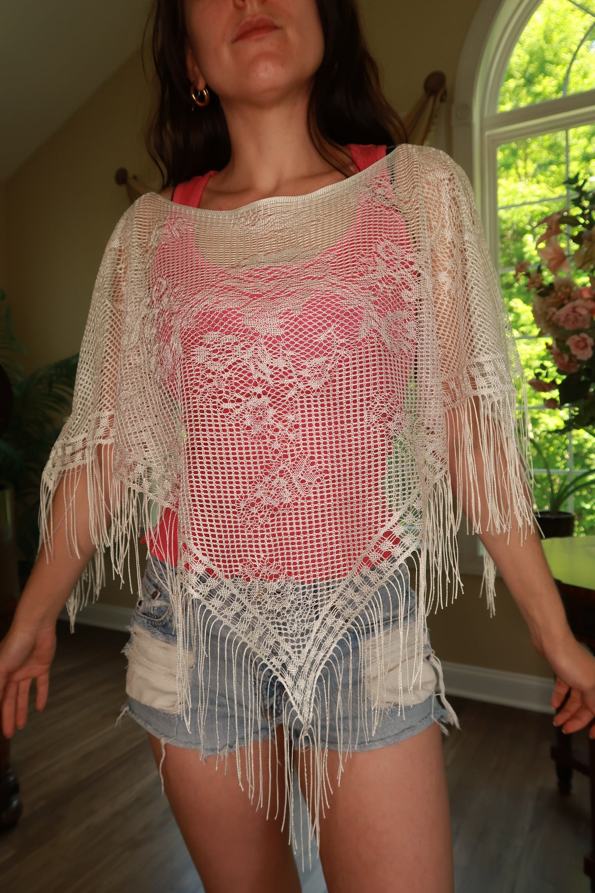 Vintage white crochet fringe poncho top for women, stylish Elektra Vintage women's top with intricate crochet details and fringe trim.