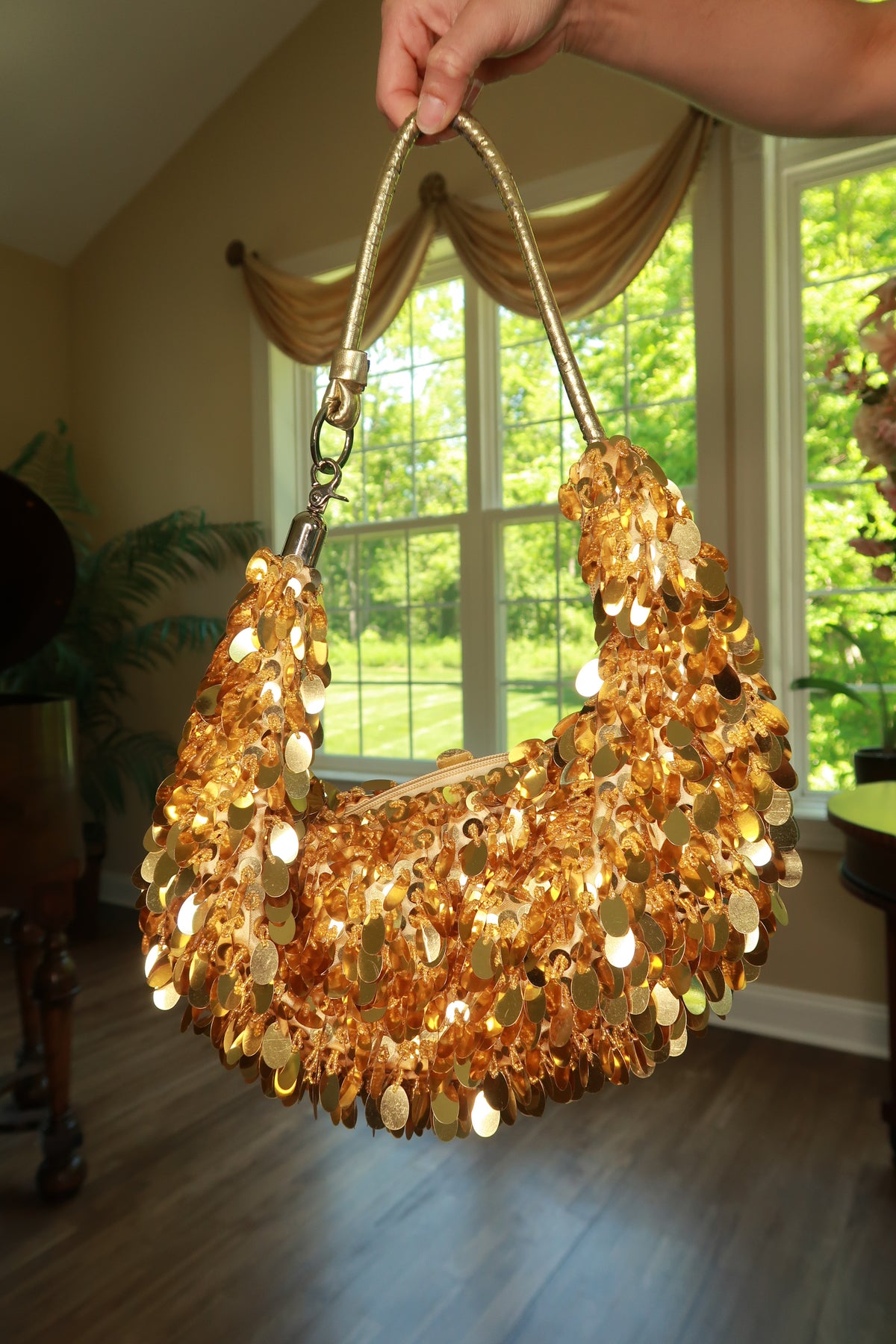 2000s vintage gold sequin hobo shoulder bag by Elektra Vintage, featuring shimmering sequins and a slouchy shoulder strap.