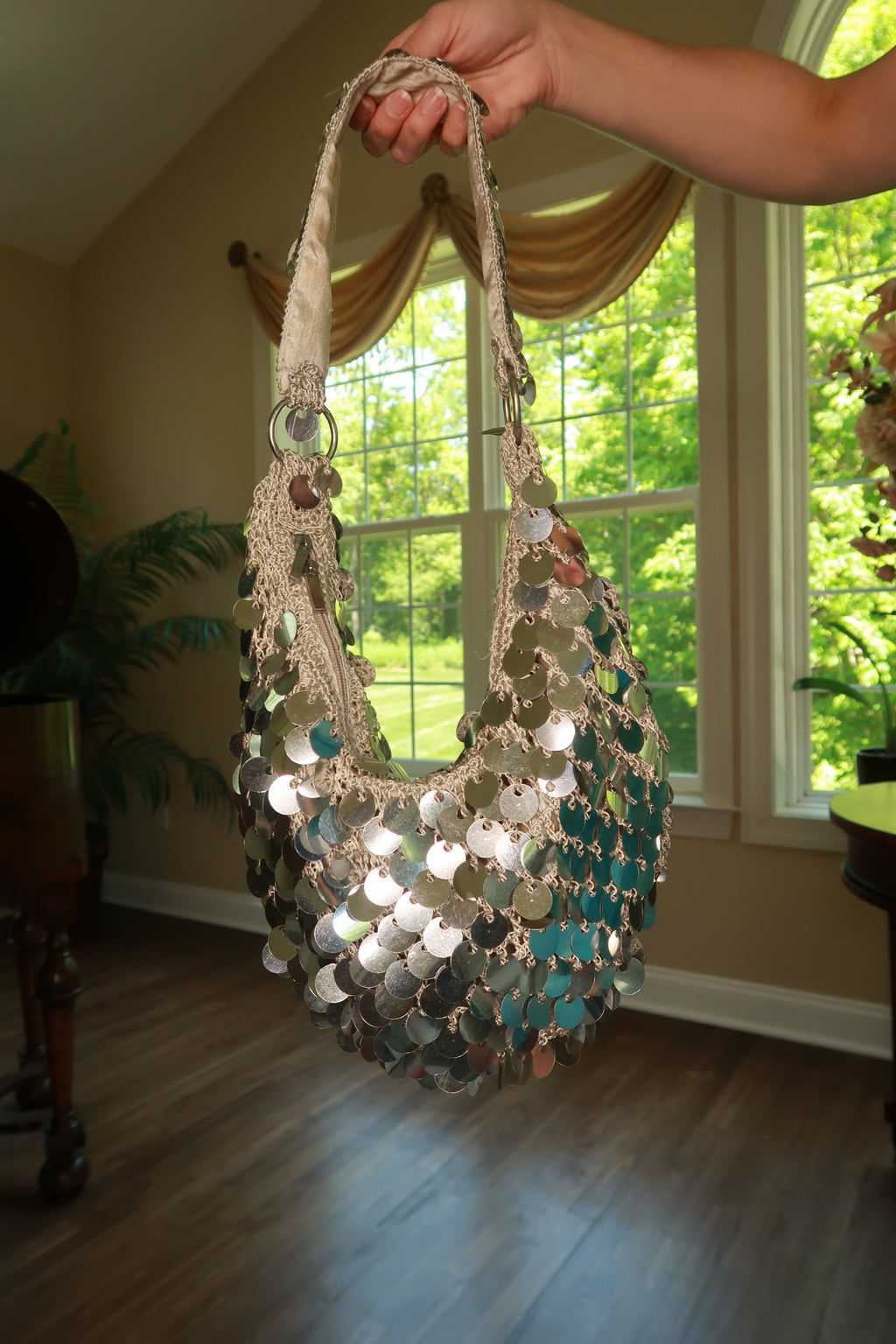 Vintage silver paillette sequin crochet shoulder bag by Elektra Vintage with shimmering embellishments and intricate crochet design.