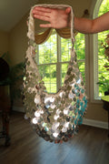 Vintage silver paillette sequin crochet shoulder bag by Elektra Vintage with sparkling embellishments and a textured crochet design.