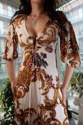 Vintage Just Cavalli baroque print dress with deep V neckline and puff sleeves, showcased by Elektra Vintage.