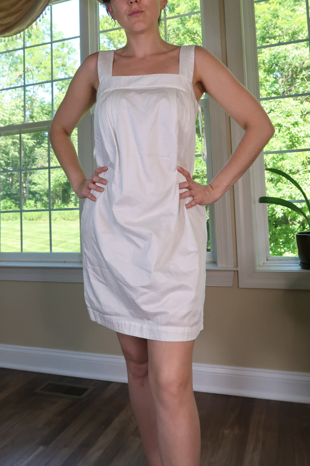 Vintage 2000s BCBG white shift mini dress by Elektra Vintage, featuring a classic sleeveless design and clean silhouette.