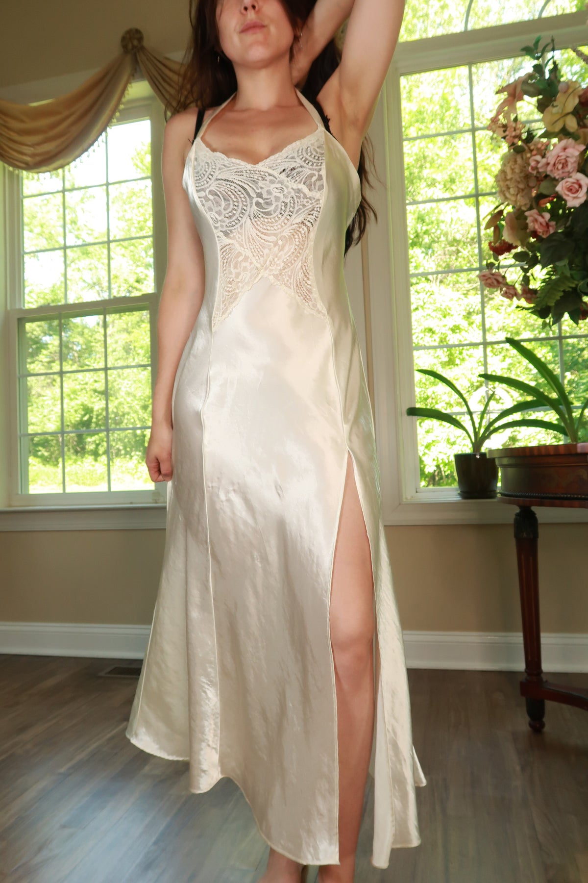 Vintage Ivory Satin Lace Slip Dress by Elektra Vintage featuring gold label, delicate lace details, and a flowing satin fabric.