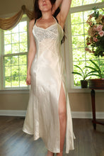 Load image into Gallery viewer, Vintage Ivory Satin Lace Slip Dress by Elektra Vintage featuring gold label, delicate lace details, and a flowing satin fabric.
