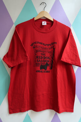 Red t-shirt with black text and graphics for the Red Dog Saloon in Juneau, Alaska