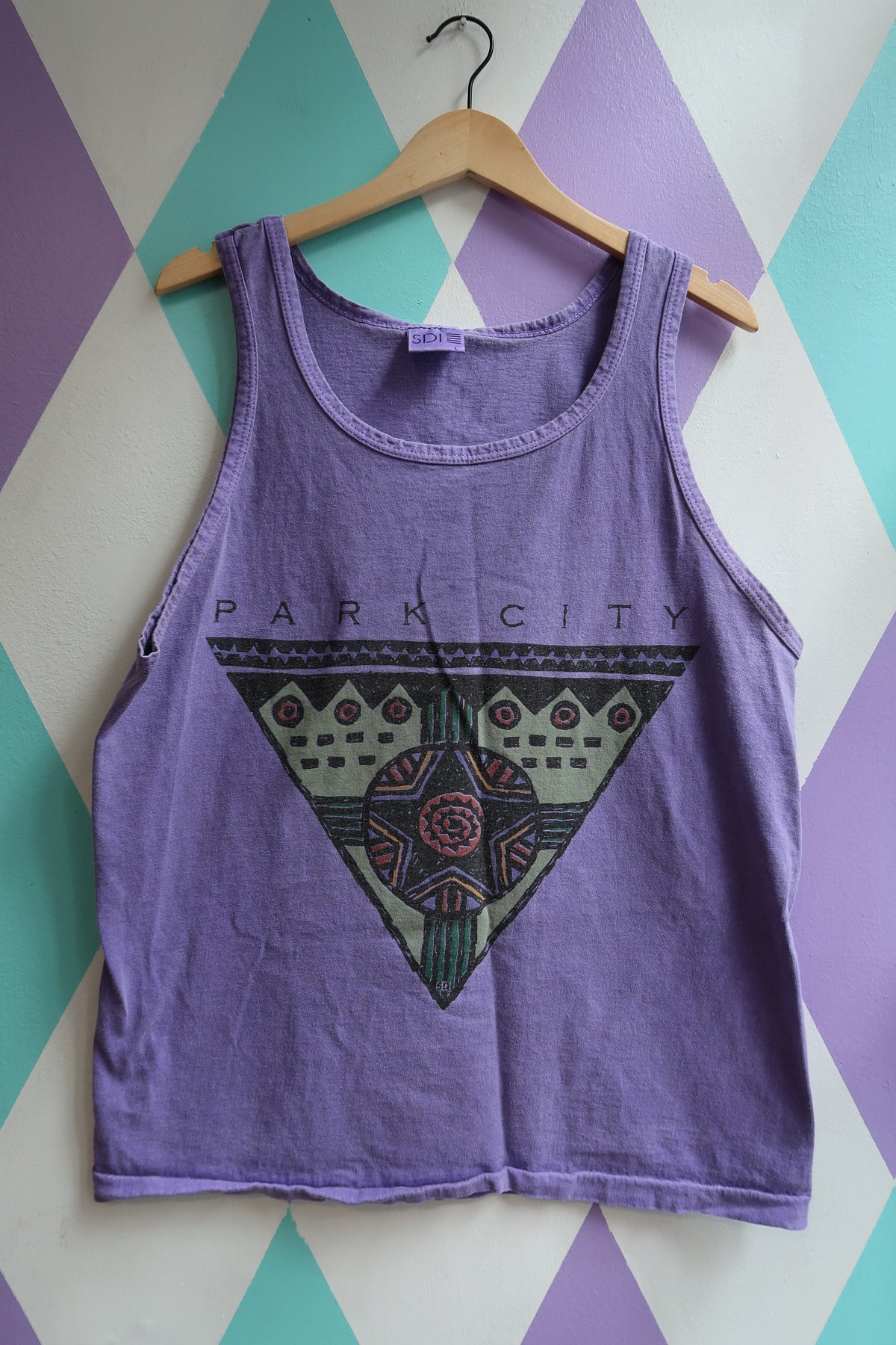 Eletra Vintage Park City tank top displayed flat, featuring a casual sleeveless design with a relaxed fit and graphic print.