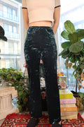 Women's vintage 90s teal crushed velvet pants by Elektra Vintage, featuring a relaxed fit and soft textured fabric.