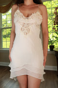 Vintage white lace chiffon babydoll slip dress by Elektra Vintage, featuring delicate lace details and a flowing chiffon fabric.