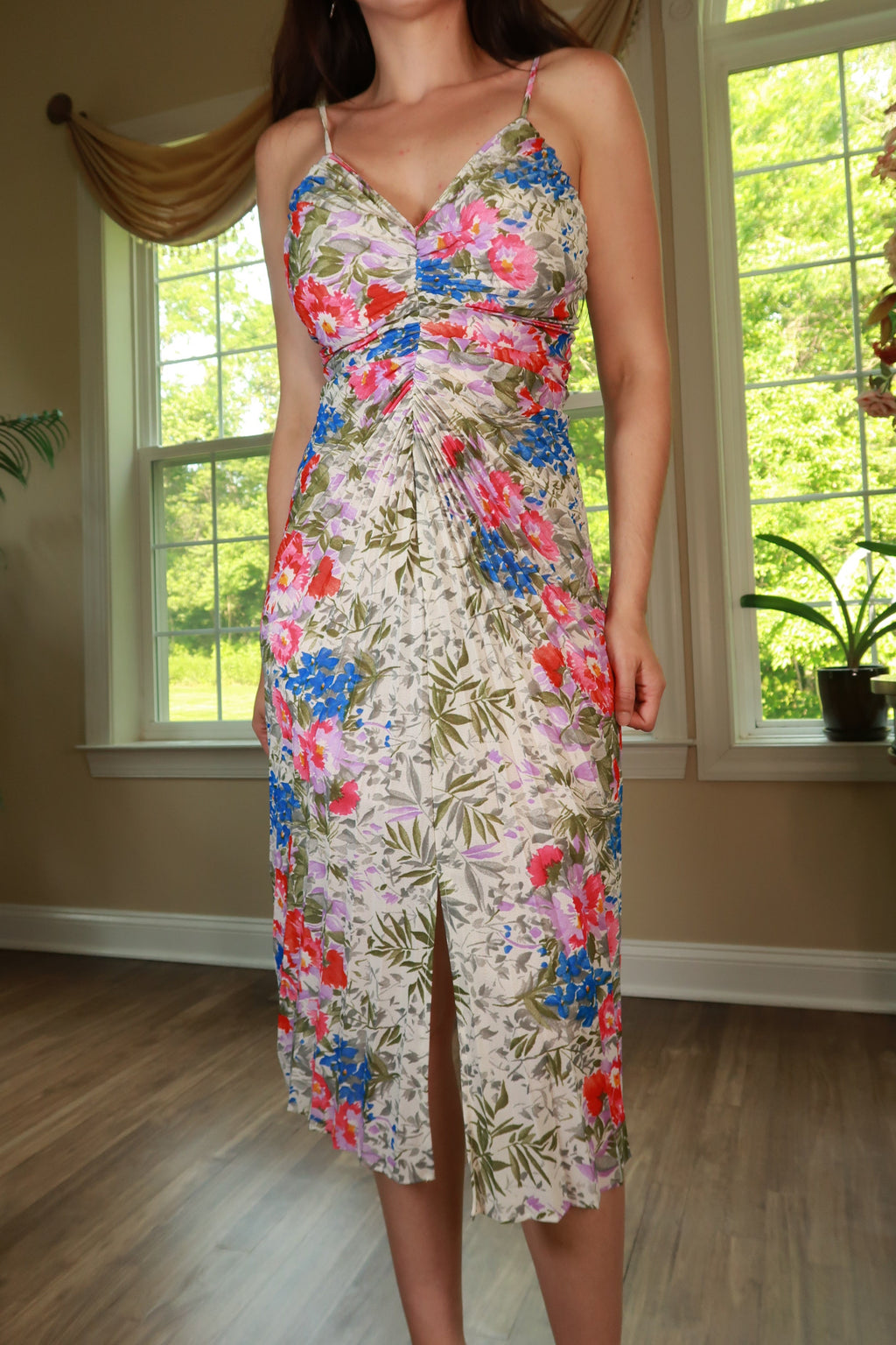 Vintage 70s Frederick's of Hollywood floral ruched midi dress by Elektra Vintage, featuring a colorful floral pattern and ruched details.