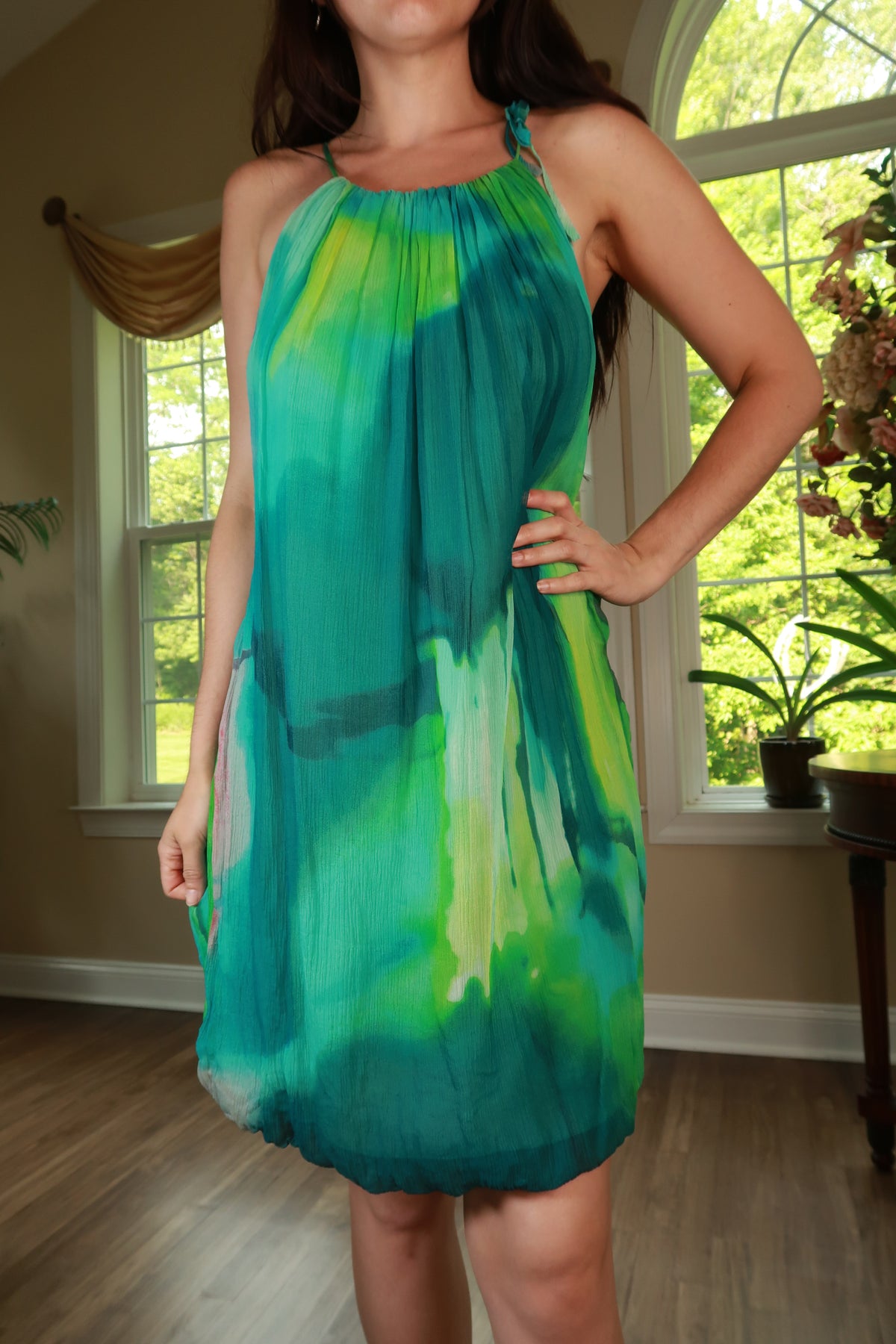 Vintage 2000s BCBG silk watercolor halter dress by Elektra Vintage, featuring elegant draped fabric and vibrant floral patterns.