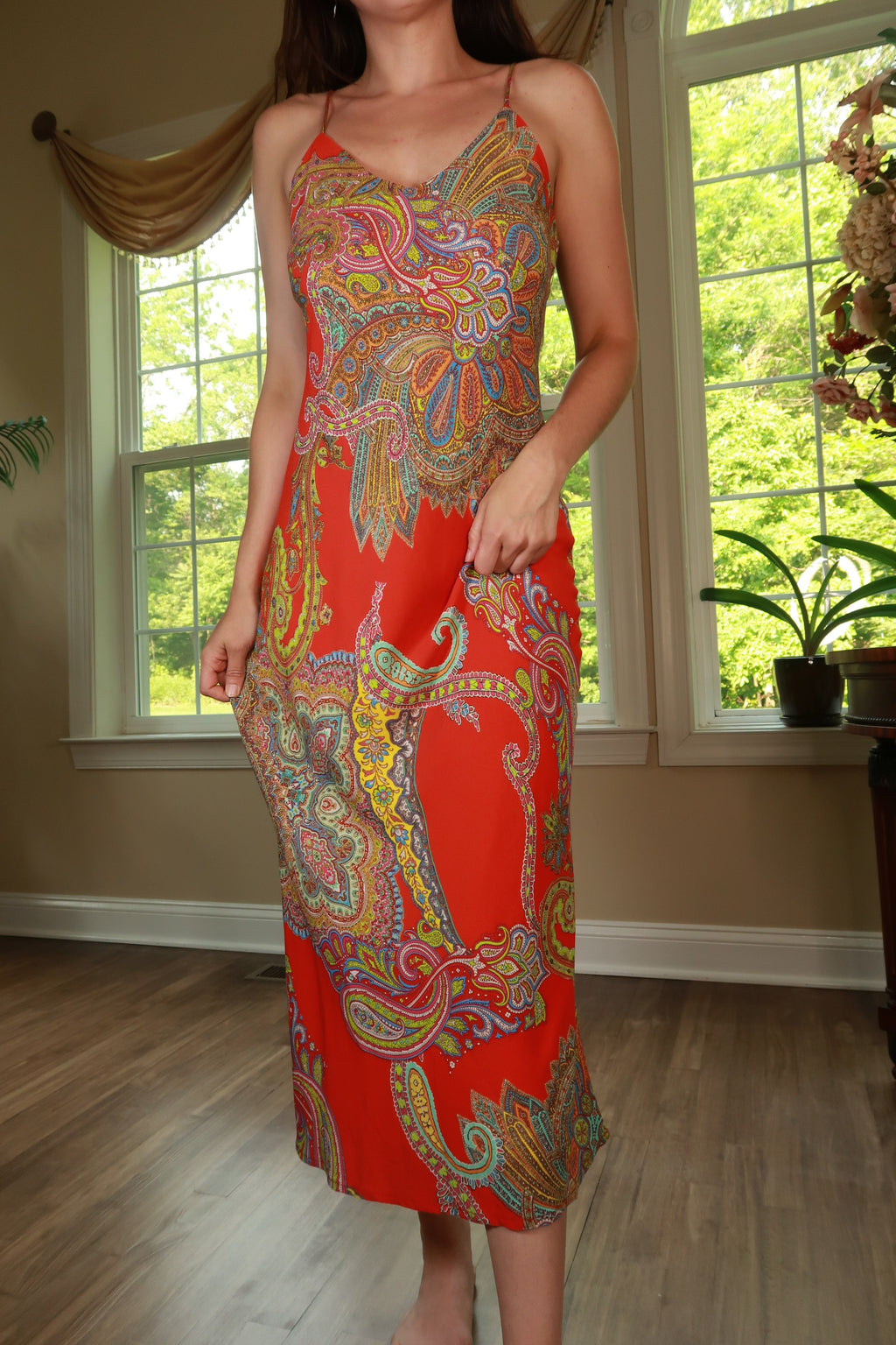 Red paisley print maxi dress by Elektra Vintage, flowing fabric with a fitted bodice and long skirt, perfect for bohemian style.