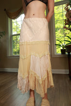 Load image into Gallery viewer, Vintage patchwork lace maxi skirt by Elektra Vintage with intricate lace details and flowing silhouette, shown on a model.
