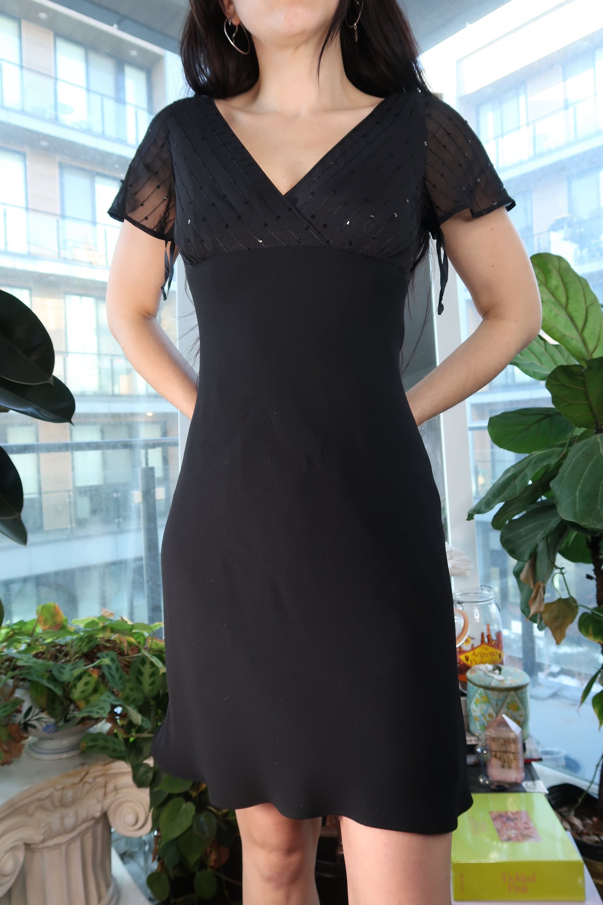 Black sequin mini dress with sheer long sleeves by Elektra Vintage, vintage 90s classic femme evening dress, form-fitting and stylish.
