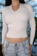 White ribbed V-neck knit top for women by Elektra Vintage, vintage 2000s fitted long sleeve Y2K style.