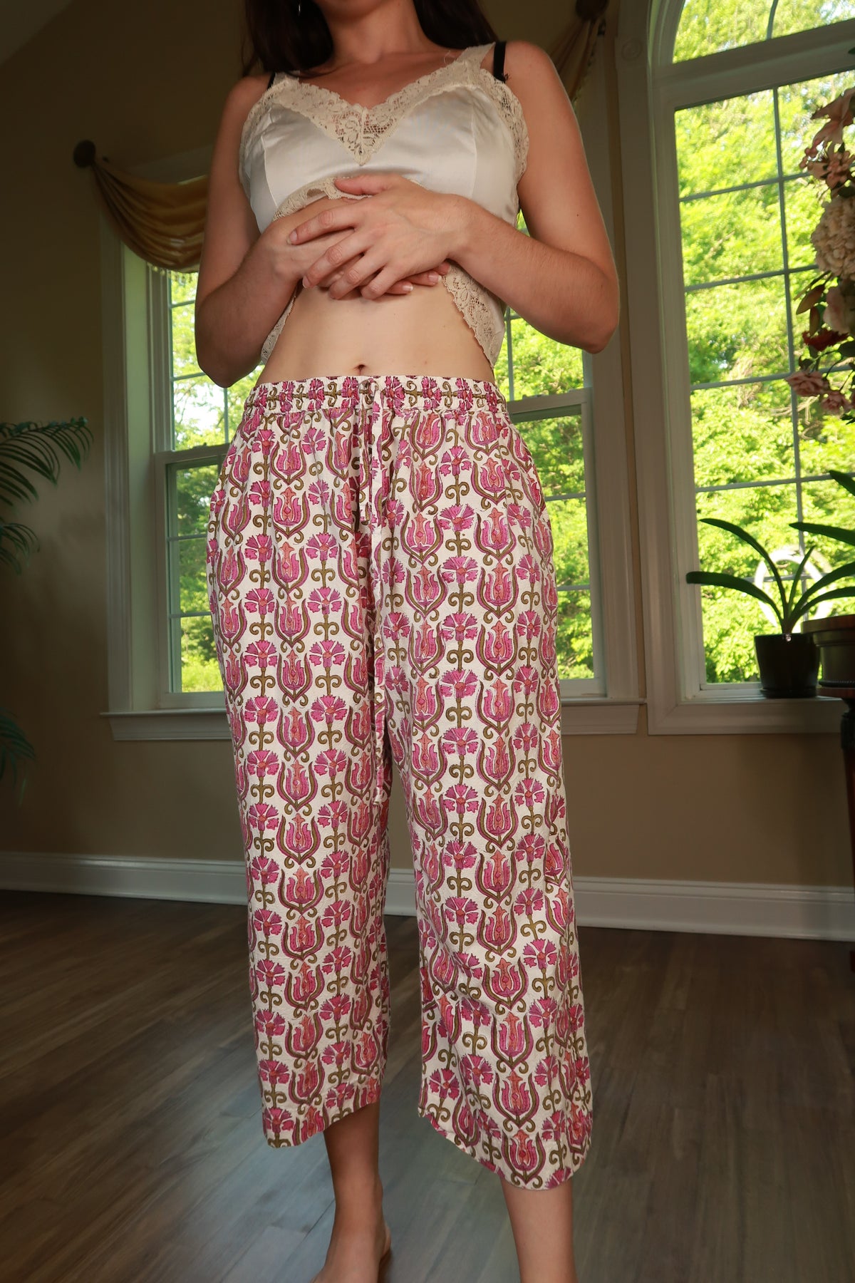Pink floral print vintage cotton cropped wide-leg pants for women by Elektra Vintage, shown on a model.