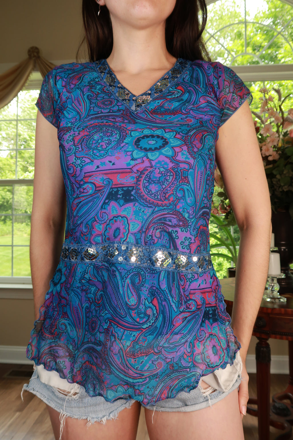 Elektra Vintage women's peplum top with vintage paisley pattern and sequin trim, showcasing a stylish, fitted design.