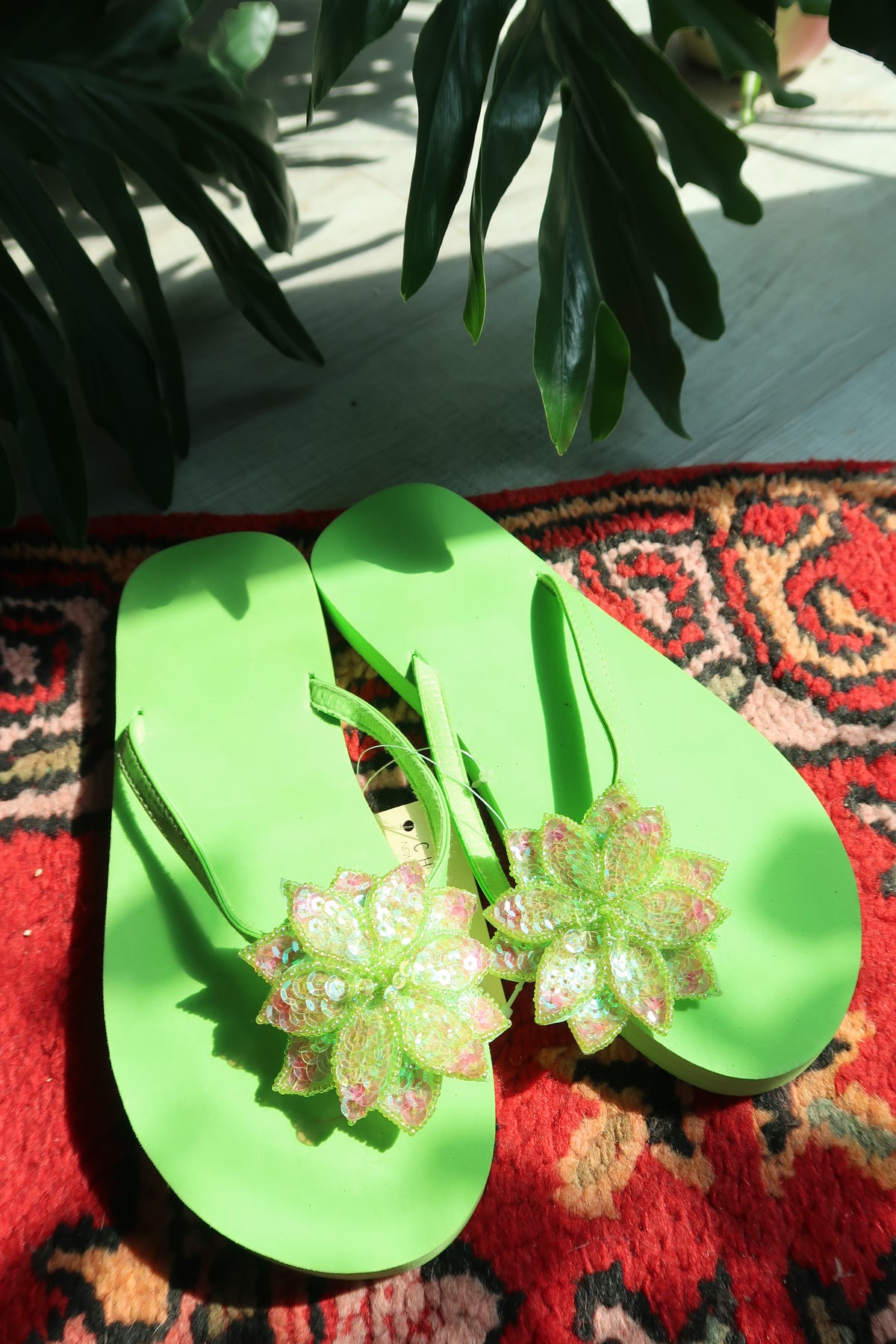 Vintage Y2K lime green sequin flip flops with floral design by Elektra Vintage, glittery 2000s style summer sandals.