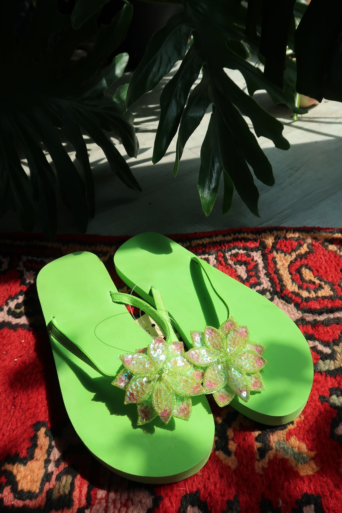 Vintage Y2K lime green sequin flip flops with flower embellishments by Elektra Vintage, featuring glittery 2000s-inspired design.