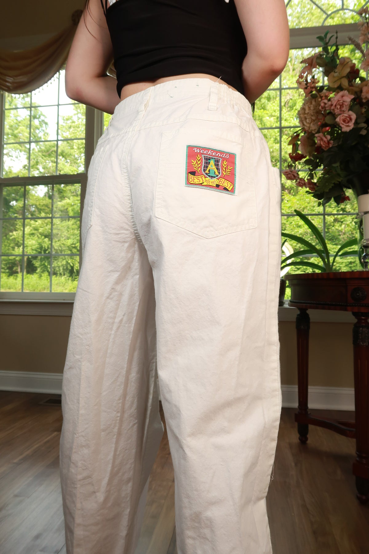 White vintage Y2K women's utility cargo pants by Elektra Vintage, featuring multiple pockets and a relaxed fit.