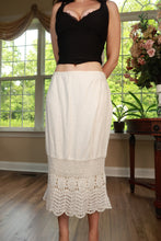 Load image into Gallery viewer, White crochet lace hem midi skirt from Elektra Vintage with vintage Y2K style, detailed lace and flowing fabric.
