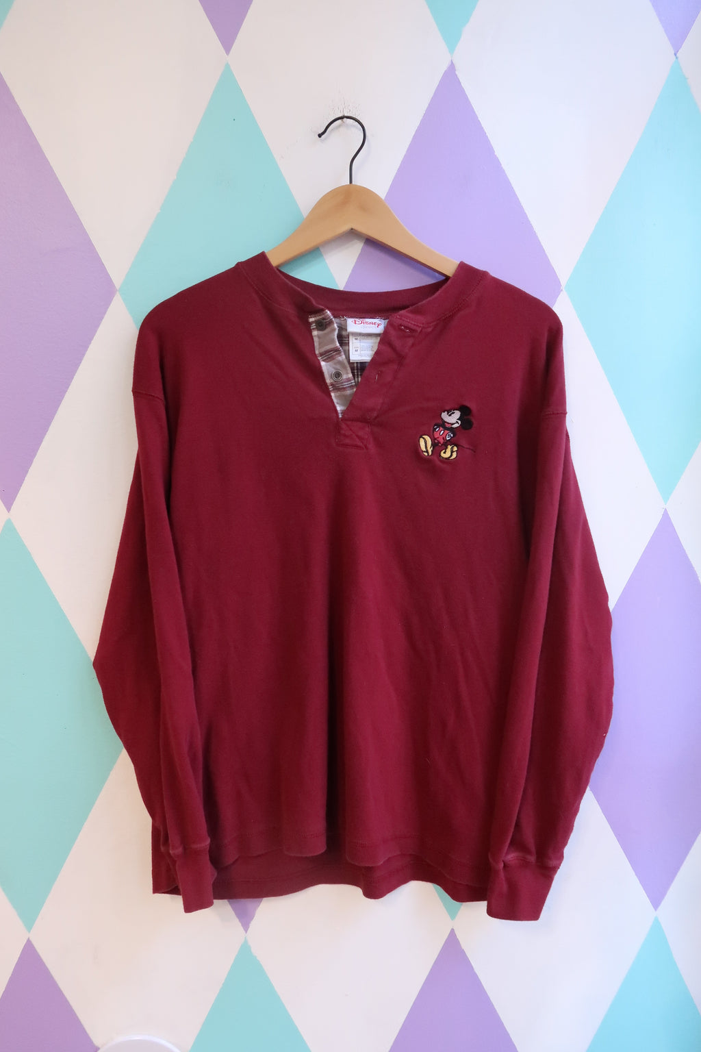 Men's vintage 2000s Disney Mickey Mouse Henley long sleeve shirt by Elektra Vintage, featuring classic Mickey Mouse design.